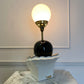 1980's White Ceramic pierrot & globe table lamp