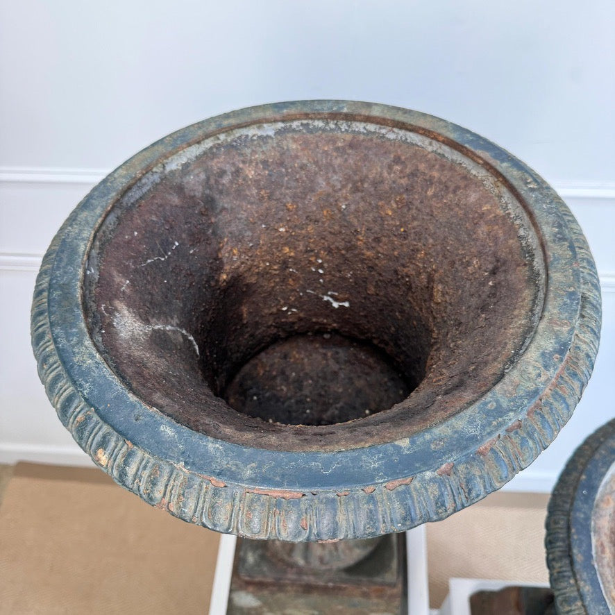 Pair of High Victorian Cast Iron Campana Urns on Plinths