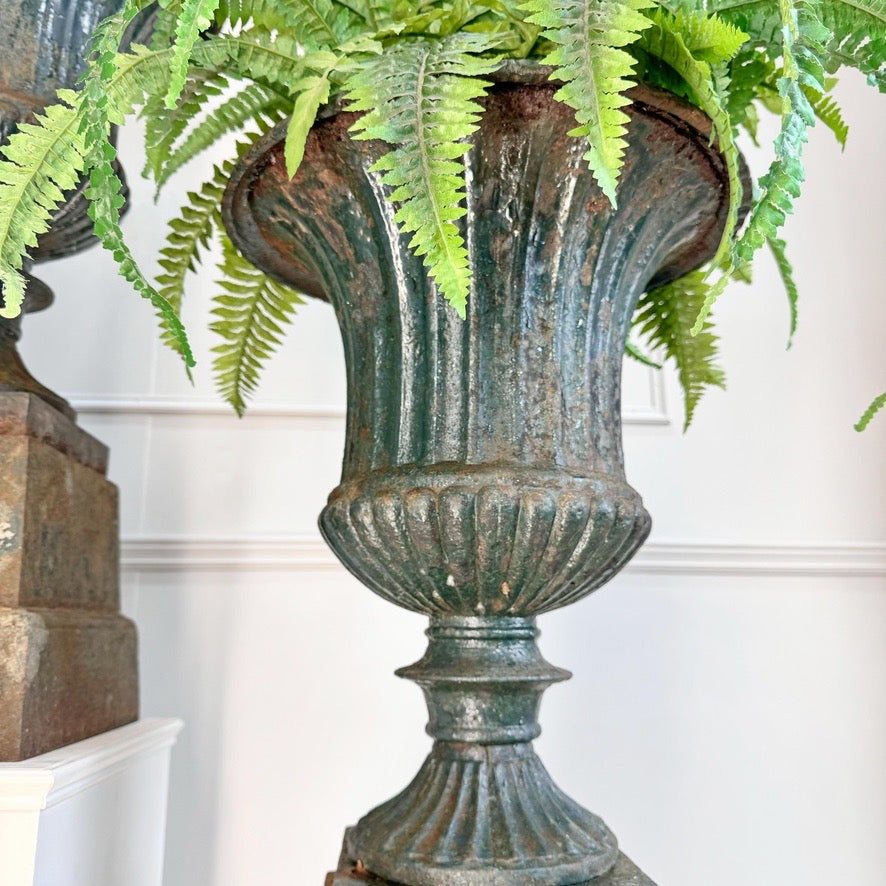 Pair of High Victorian Cast Iron Campana Urns on Plinths