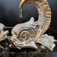 Gabriella Crespi 'Coppia di Delfini' Pair of Rams Horn and Silvered Bronze Mythical Dolphins Each Signed to Base