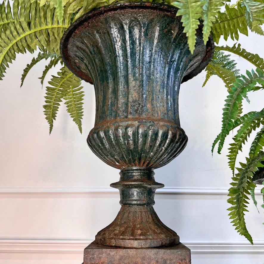 Pair of High Victorian Cast Iron Campana Urns on Plinths