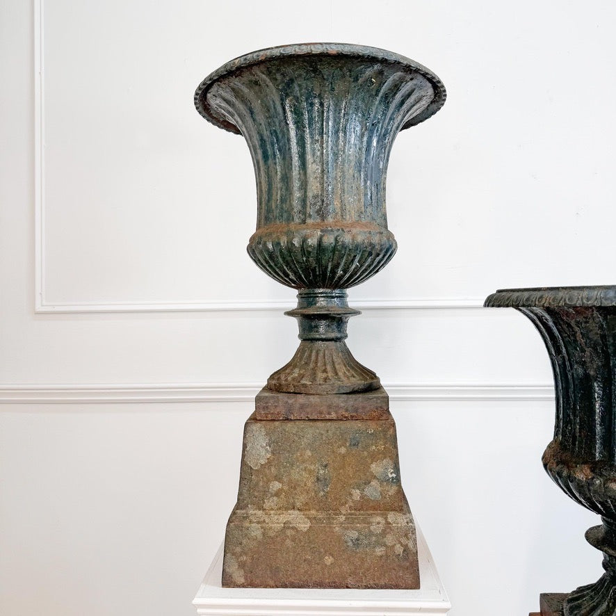 Pair of High Victorian Cast Iron Campana Urns on Plinths