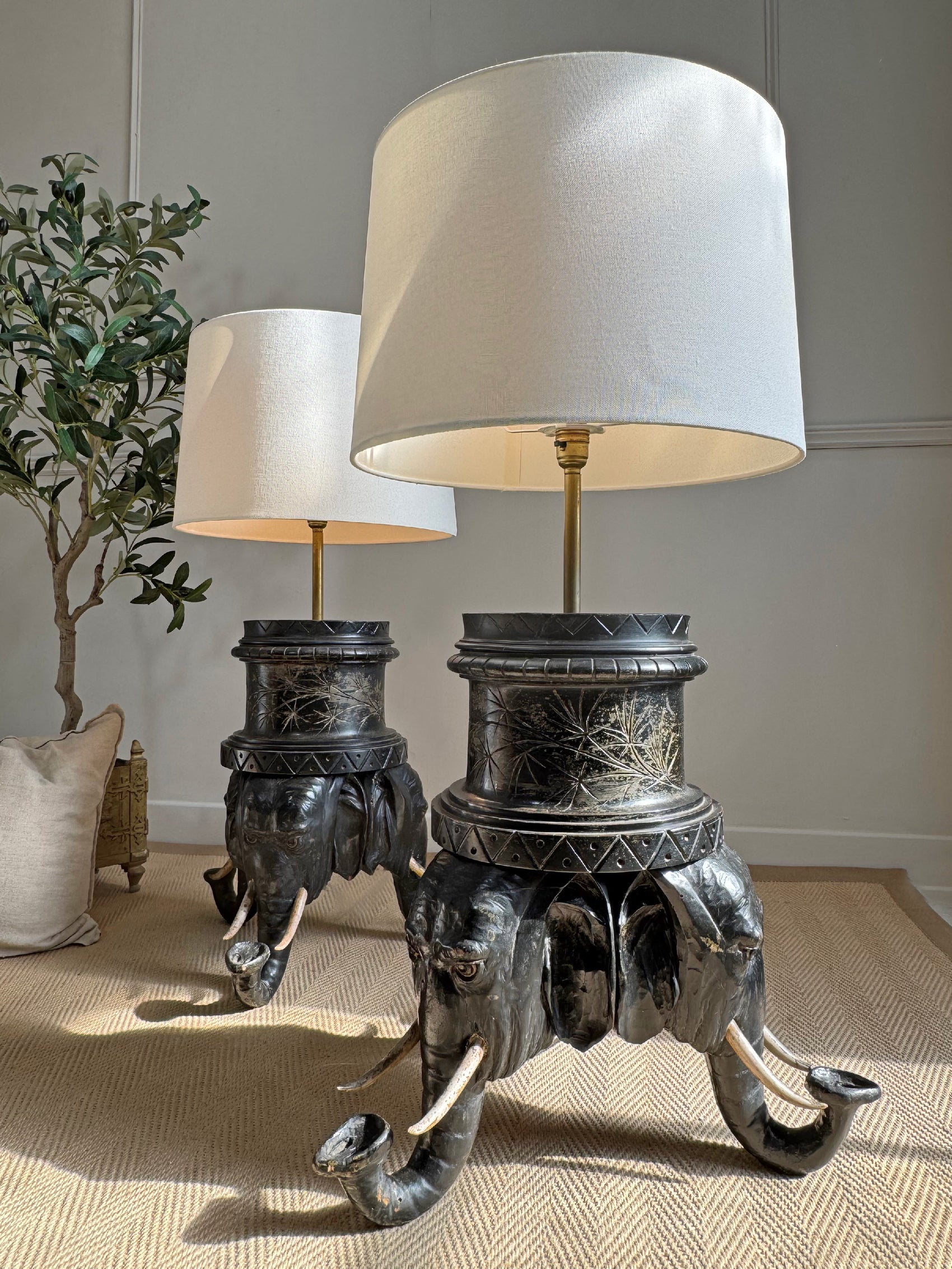 An Exceptional Pair of Reimagined 19th-Century Anglo-Indian Carved Hardwood Elephant Lamps