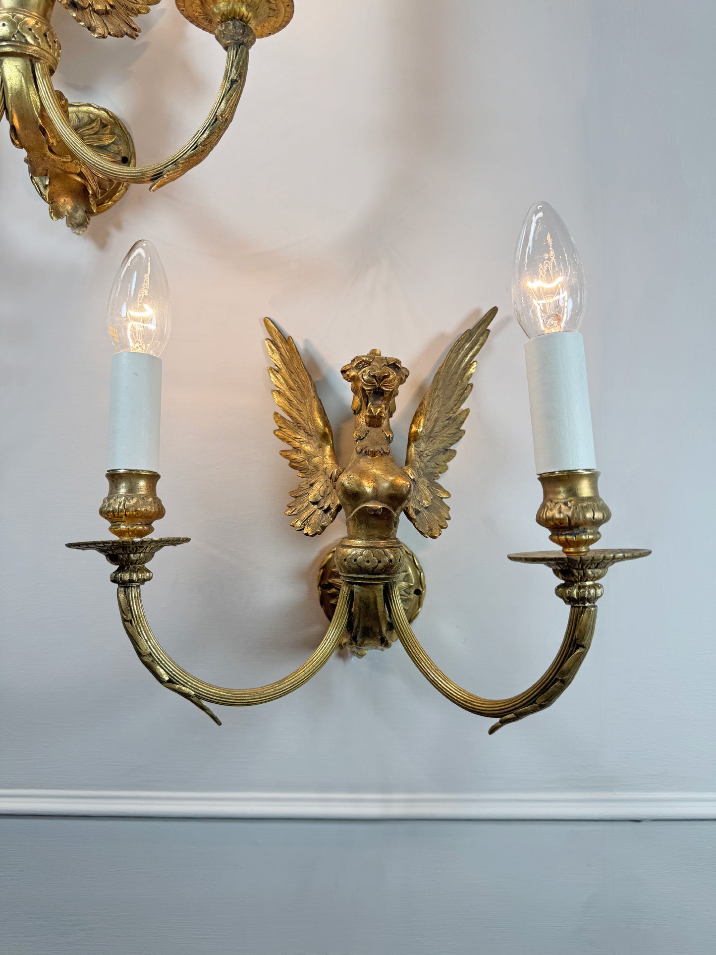 Pair of Late 19th Century Gilded Bronze Female Griffin Empire Wall Lights