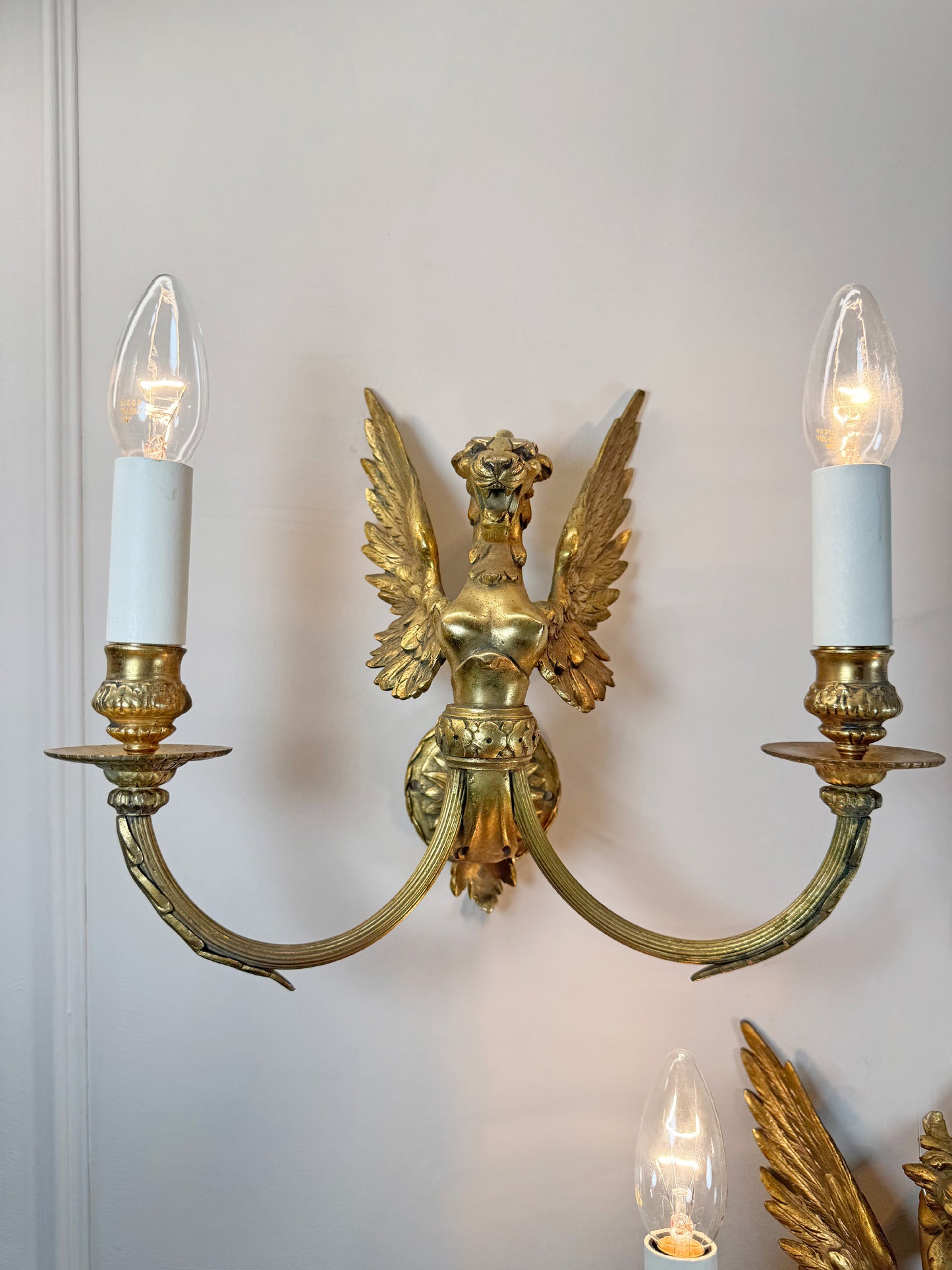 Pair of Late 19th Century Gilded Bronze Female Griffin Empire Wall Lights