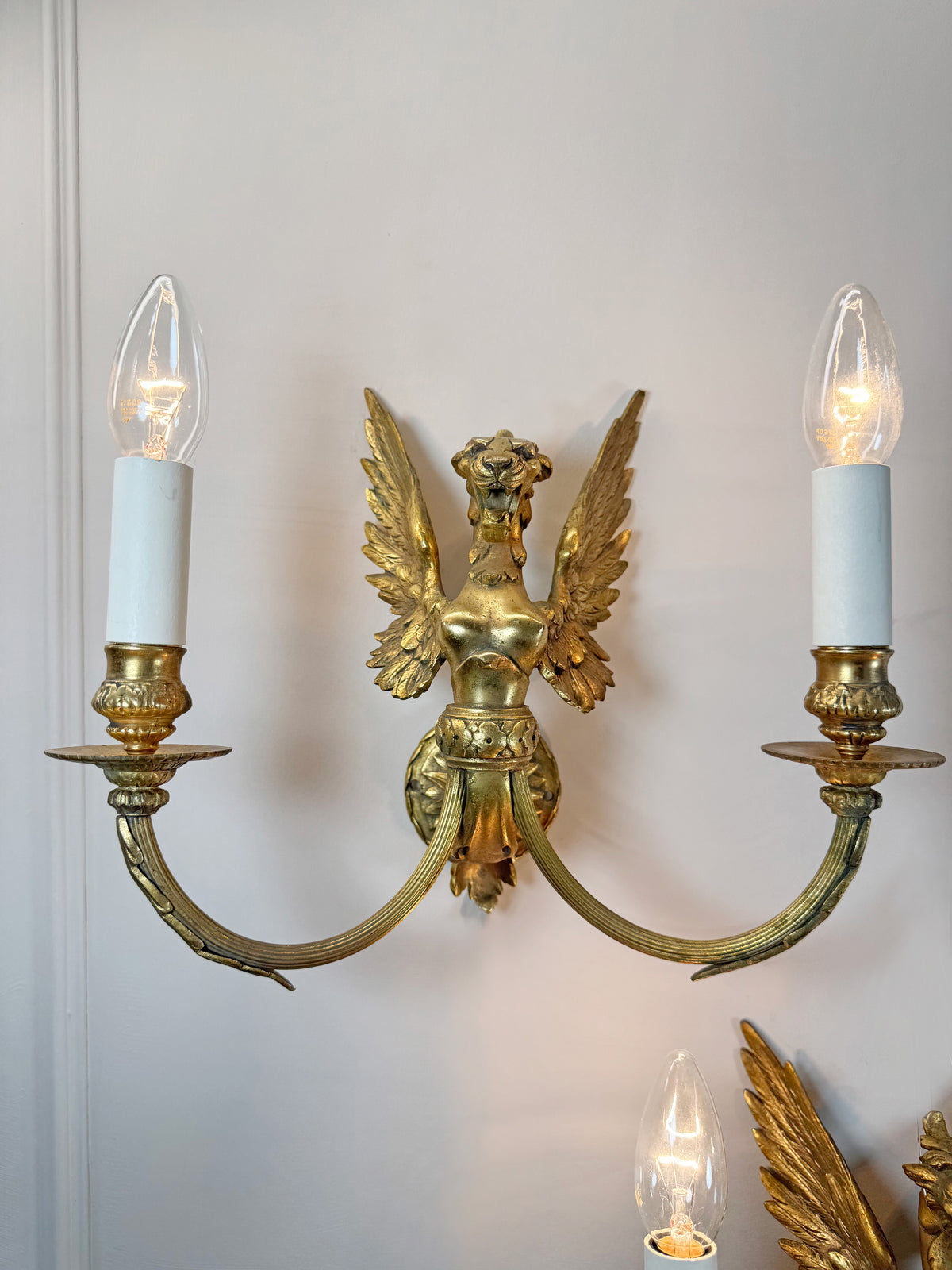 Pair of Late 19th Century Gilded Bronze Female Griffin Empire Wall Lights