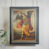 A framed religious Cuzco painting of a winged angel Zadkiel with outstretched wings, holding a sword and shield, hanging on a light wall with a small plant leaf visible at the lower left.