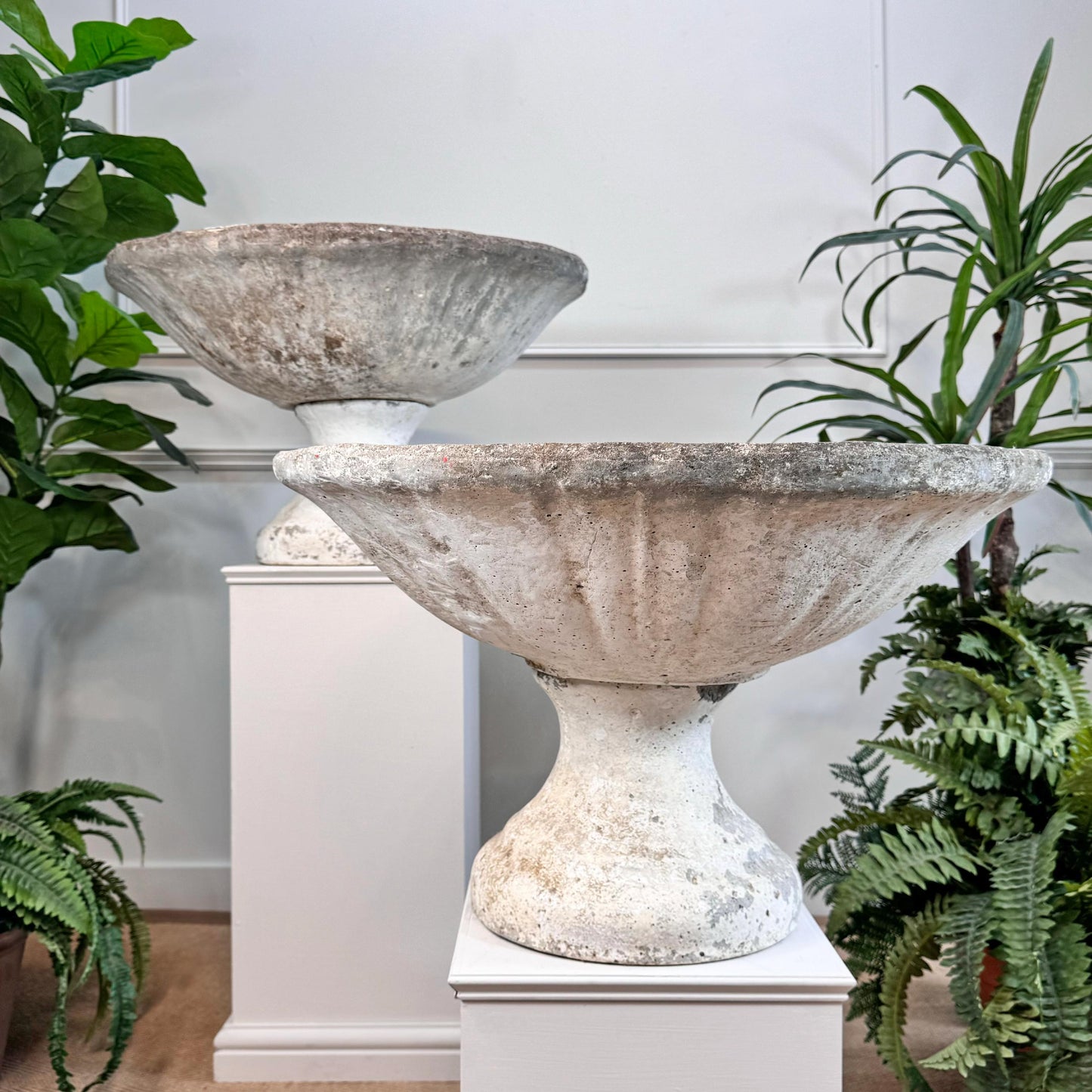Great pair of composite garden fountains, French and hand made in the early 20th century. Original white paint to the exterior, each fountain is in two parts comprising the base and top. Both still have the original pipe for the water in place. Could also be easily re-purposed as a pair of decorative urns.
