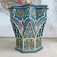 A decorative blue Moroccan Star octagonal wooden box with intricate hand-painted Moroccan-style patterns in blue, gold, red, and beige, set against a neutral indoor background.