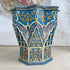 A decorative blue Moroccan Star octagonal wooden box with intricate hand-painted Moroccan-style patterns in blue, gold, red, and beige, set against a neutral indoor background.