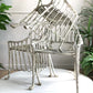 Exceptionally rare set of four chairs, Brazilian, circa 1970. Highly unusual sweeping faux Bamboo and Palm Leaf seat design, in Cast Aluminium.