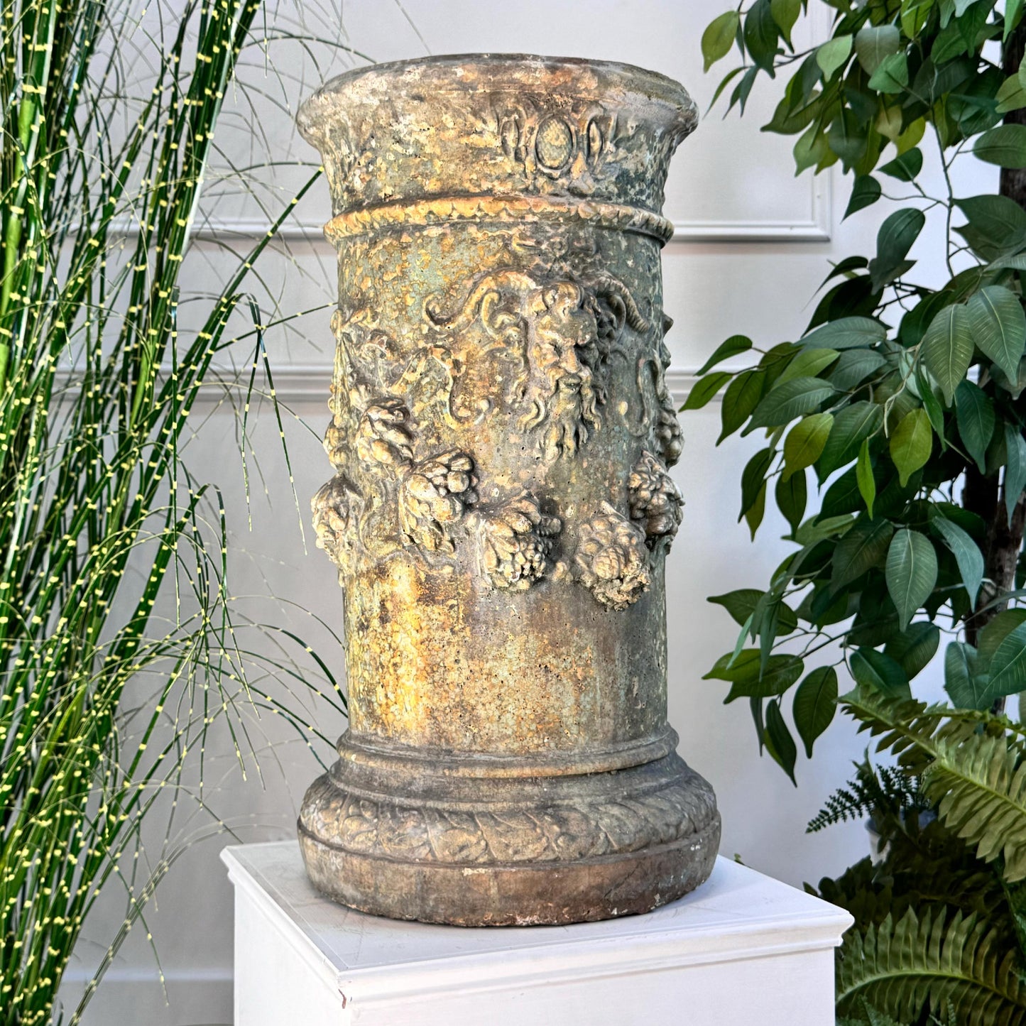 A splendid decorative column, profuse with Satyr masks, laurel and vines. Would have had an iron sundial on the top, this has been lost over time, but could be easily replaced. An absolutely stunning composite column, with flashes of green, reds and brown throughout