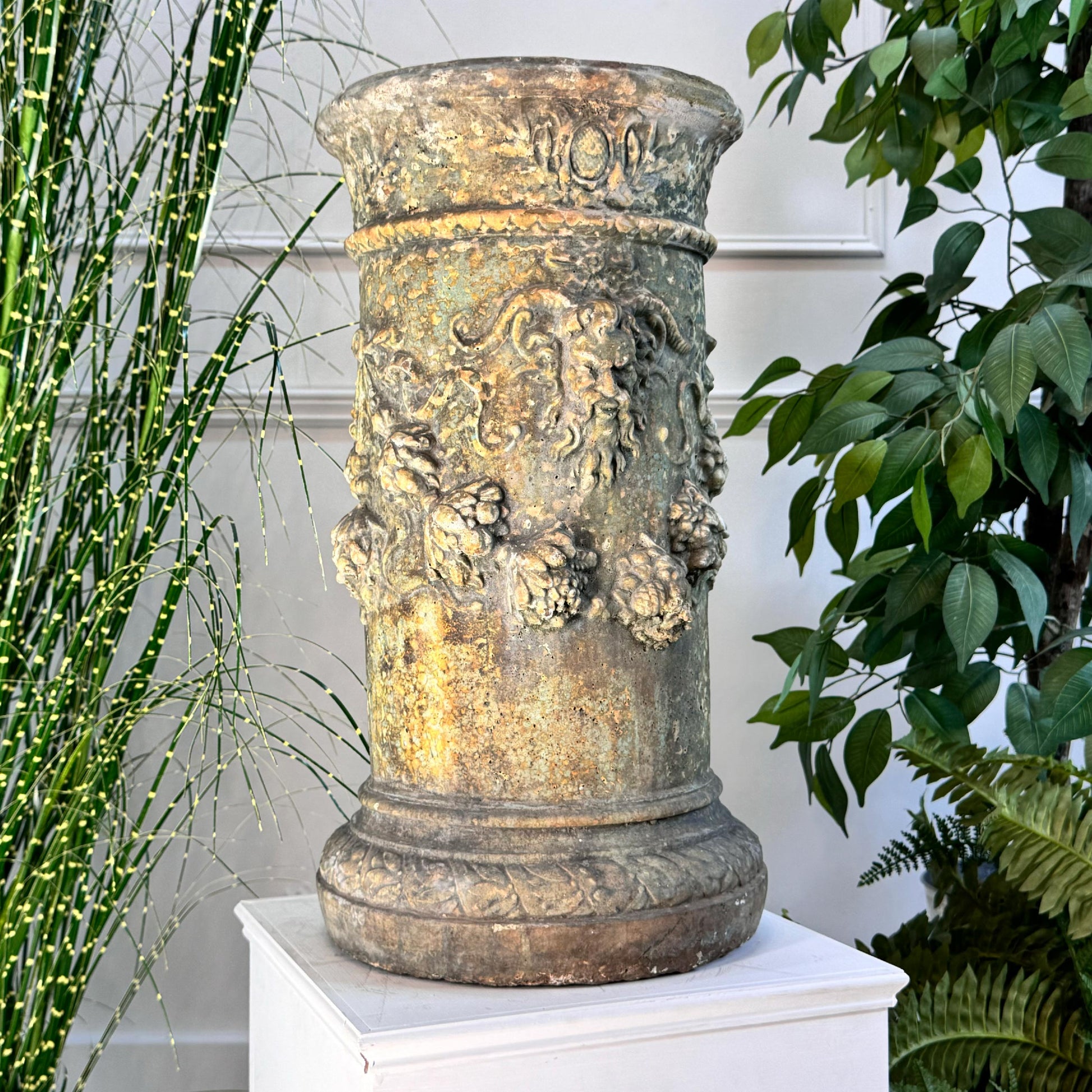 A splendid decorative column, profuse with Satyr masks, laurel and vines. Would have had an iron sundial on the top, this has been lost over time, but could be easily replaced. An absolutely stunning composite column, with flashes of green, reds and brown throughout