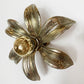 A Willy Daro flower-shaped wall light with five textured petals and a pbulb in center, shown on a plain white background.