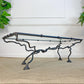 A wonderfully ornate hand crafted mid-century wrought iron coffee table, the legs worked and twisted to give the impression of a Leopard or Gazelle running, the animalistic design has been exceptionally well executed, with great attention given to every detail of the iron work, all the way down to the paw like feet.